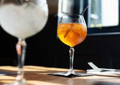 Two cocktails on a wooden table